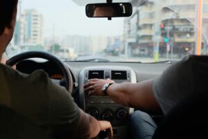 two guys driving in car