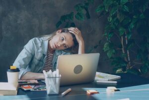 overwhelmed woman on computer