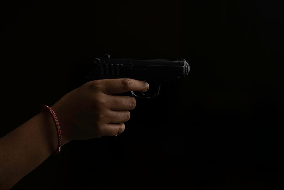 woman holding gun