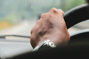 hand on steering wheel